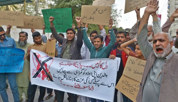 Pakistani demonstrators hold posters as they take part in a protest against Valentineu2019s Day in Karachi yesterday. Pakistan president Mamnoon Hussain has urged the nation to refrain from celebrating Valentineu2019s Day, while other officials blasted it as u201cvulgar and indecentu201d as they moved to outlaw festivities.
