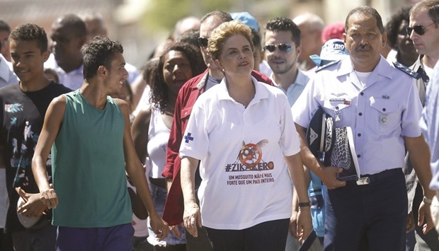 Brazilu2019s President Dilma Rousseff walks with residents at an event yesterday on the u2018National Day of Mobilisation u2013 Zika Zerou2019 in Rio de Janeiro.