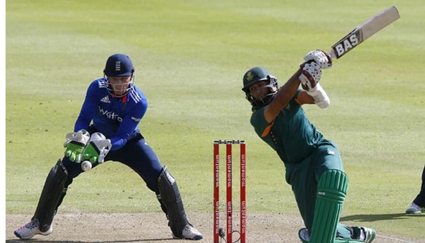 South Africa's Hashim Amla plays a shot as England's Jos Buttler looks on during the One Day International in Cape Town on Sunday.