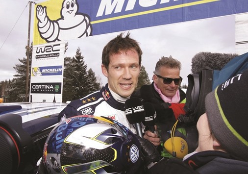 Frenchman Ogier speaks to reporters after winning Rally of Sweden. (Reuters)