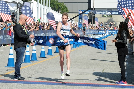 Galen Rupp crosses the finish line to win the US Olympic Team Trials menu2019s marathon in Los Angeles on Saturday. (AFP)
