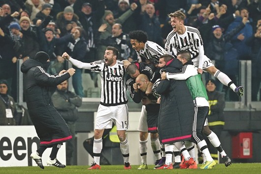 Juventus players celebrate after scoring  a goal during the Italian Serie A  match against Napoli.