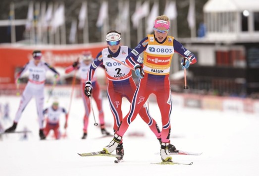 Norwayu2019s Therese Johaug is chased by her compatriot Heidi Weng during the womenu2019s 10 km mass start competition at the FIS Cross-Country World Cup in Falun, Sweden, yesterday. (AFP)