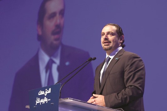 Lebanonu2019s former prime minister Saad al-Hariri addresses his supporters during the 11th anniversary of the assassination of his father, Rafik al-Hariri, in Beirut yesterday.