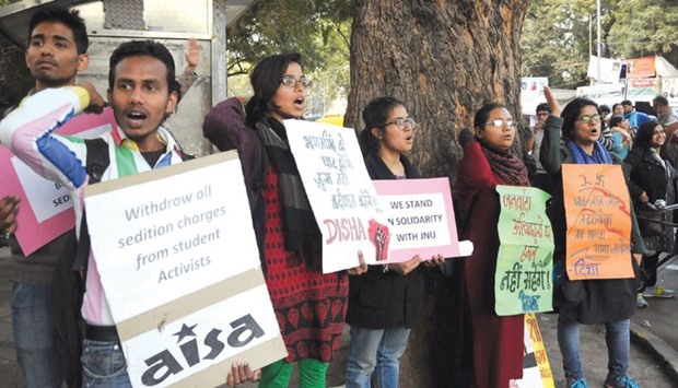 Activists of the All India Studentsu2019 Association stage a demonstration demanding that sedition charges against JNU Students Union president Kanhaiya Kumar be dropped, at Jantar Mantar in New Delhi yesterday.