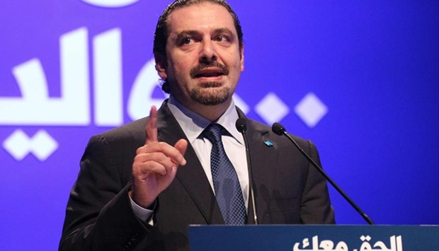 Former Lebanese prime minister Saad Hariri delivers a speech during a gathering to mark the 11th anniversary of the assassination of his father and Lebanon's former prime minister in Beirut.  Rafiq Hariri and 22 others, including a suspected suicide bomber, died in a massive car bomb blast on the Beirut waterfront on February 14, 2005.