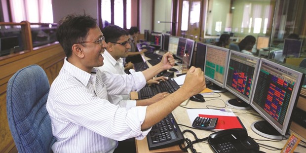 Stock traders at a brokerage firm in Mumbai. The Sensex rose 2.5% yesterday.