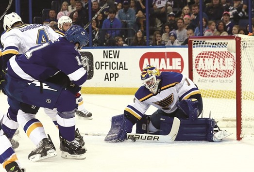 St. Louis Blues goalie Brian Elliott makes a save against Tampa Bay Lightning center Brian Boyle (No 11) during the second period at Amalie Arena. PICTURE: USA TODAY