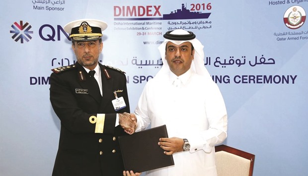 Staff Brigadier (Sea) Abdulbaqi S al-Ansari and Abdulla Mubarak al-Khalifa exchanging the agreement.