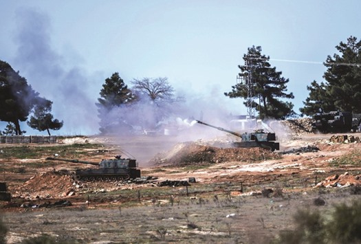 Turkish tanks stationed at a Turkish army position near the Oncupinar crossing gate close to the town of Kilis, south central Turkey, fire towards the Syria border, yesterday. Turkey is in favour of a ground operation into neighbouring Syria only with its allies.