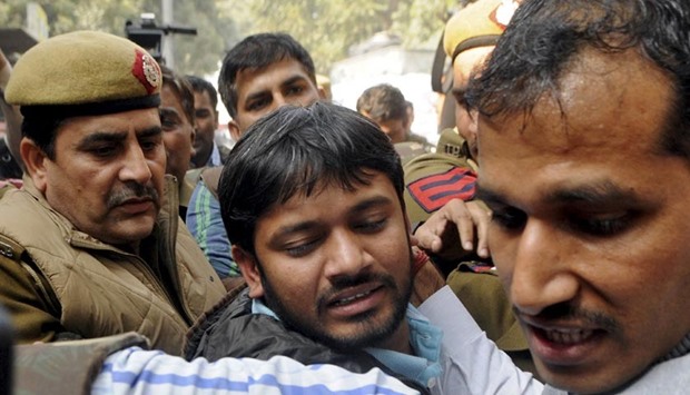 Kanhaiya Kumar (centre), head of the student union at Jawaharlal Nehru University, is escorted by police outside the Patiala House court in New Delhi on Wednesday.