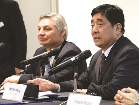 Wang ShuSheng (right), chairman of Okay Airways, and Ray Conner, president and CEO of Boeing commercial airplanes, speak to reporters at the signing of agreement during the Singapore Airshow yesterday. Boeing said it has won a commitment from Chinau2019s Okay Airways to buy 12 aircraft from the 737 family in a deal worth $1.3bn.