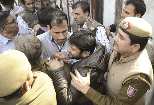 JNU students union leader Kanhaiya Kumar is escorted by police outside the Patiala House court in New Delhi yesterday.