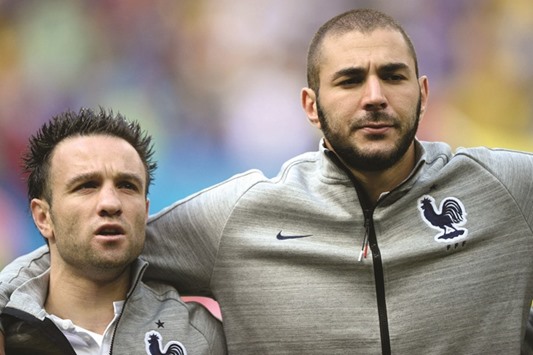 This file photo shows France midfielder Mathieu Valbuena (L) and forward Karim Benzema during the 2014 FIFA World Cup.
