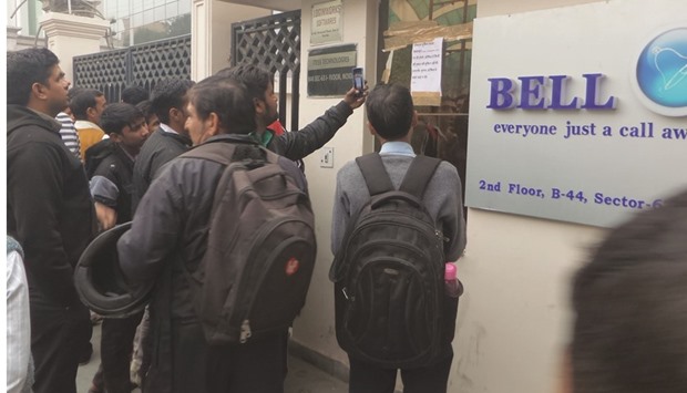 People wait in front of the office of Ringing Bell to buy its newly launched Freedom 251 smartphone yesterday.