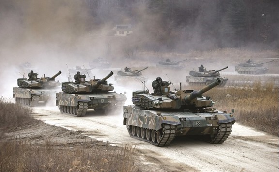 South Korean K-2 tanks take part in a live-fire drill in Yangpyeong district yesterday.