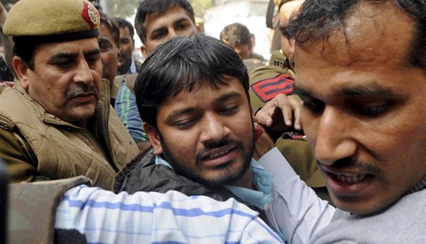 Kanhaiya Kumar, head of the student union at Jawaharlal Nehru University, is escorted by police outside the Patiala House court in New Delhi earlier this week..