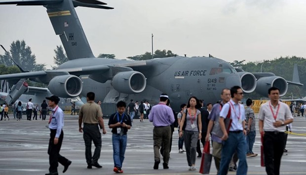 Visitors look at a US Air Force Boeing C-17 Globemaster III military transport aircraft at the Singapore Airshow on Friday.