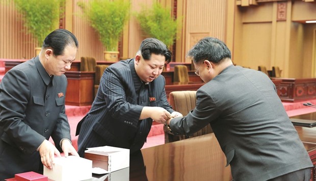 North Korean leader Kim Jong-Un attends an award ceremony for the scientists, technicians, workers of earth observation satellite Kwangmongsong-4 in this undated file photo released by Korean Central News Agency (KCNA).