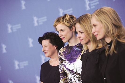 Actresses (from left) Dorota Kolak, Julia Kijowska, Marta Nieradkiewicz and Magdalena Cielecka pose during a photocall to promote the movie Zjednoczone stany milosci (United States of Love) at the 66th Berlinale International Film Festival in Berlin.