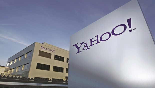 A Yahoo logo is pictured in front of a building in Rolle, Geneva. Yahoo! hired financial advisers and told independent board members to explore its strategic options, taking steps to transform itself and consider deals amid rising pressure from investors.