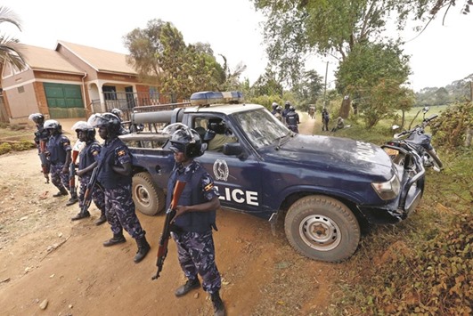 Riot police block a driveway leading to the home of opposition politician and Forum for Democratic Change party presidential candidate Kizza Besigye on the outskirts of Ugandau2019s capital Kampala.