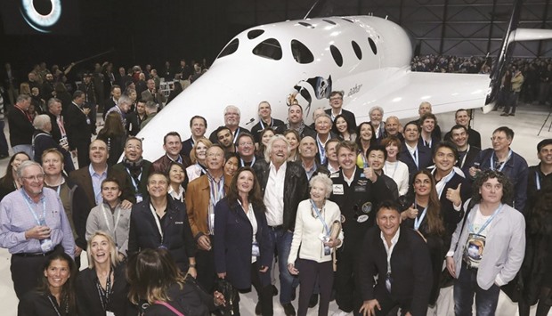Sir Richard Branson poses with his mother Eve and future astronauts after unveiling the new SpaceShipTwo in Mojave on Friday.