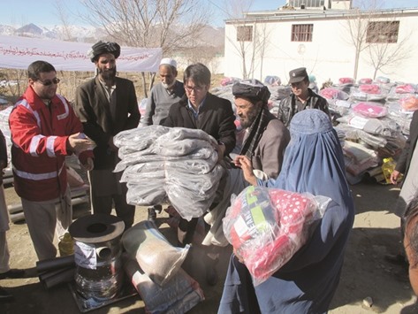 Food, clothes, heaters, and blankets were among the items distributed to Afghan families.