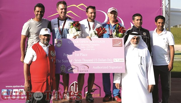 Qatar Shooting and Archery Association secretary general Abdulla Ali al-Mutawa al-Hammadi with the winners of the menu2019s skeet at Lusail Shooting Range yesterday. Frenchman Anthony Terras (back row, third from left) won ahead of Argentinau2019s Gonzalo Gil (back row, second from left) and Russiau2019s Valeriy Shomin (back row, third from right). Kuwaitu2019s Saud Abib, Qataru2019s Masoud Saleh Hamad and Nasser Saleh al-Attiyah rounded up the top six.
