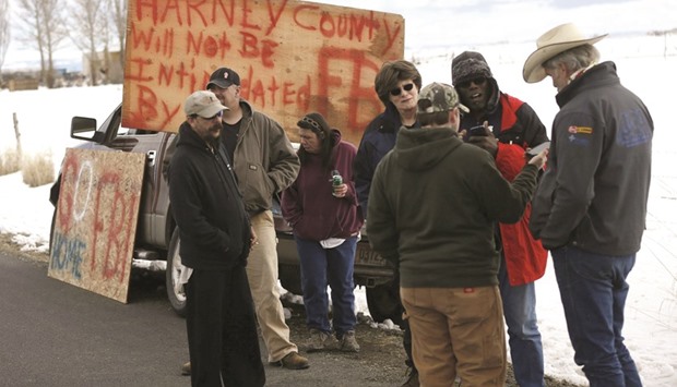 Harney County residents gather to protest the FBIu2019s presence at the Burns Municipal Airport.