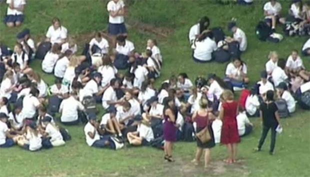 Students massing on fields after phone threat