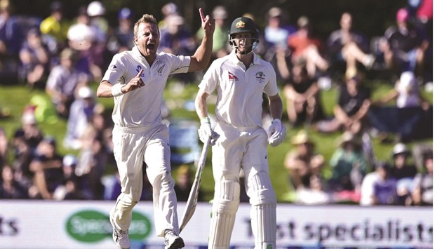 New Zealand fast bowler Neil Wagner (left) celebrates after dismissing Australian captain Steve Smith, with Adam Voges at the non-striker's end during Day 2 of the second Test yesterday. (AFP)