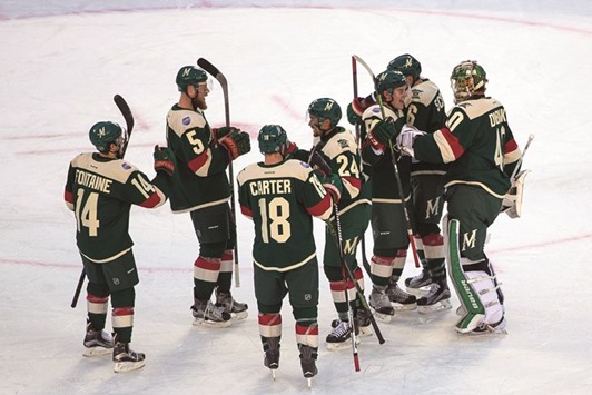 Minnesota Wild  players celebrate their win against the Chicago Blackhawks in a stadium series game at TCF Bank Stadium in Minneapolis. PICTURE: USA TODAY