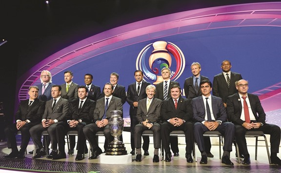 The coaches of the 16 participating teams pose at the end of the official draw of the Copa America Centenario in New York on Sunday. (AFP)