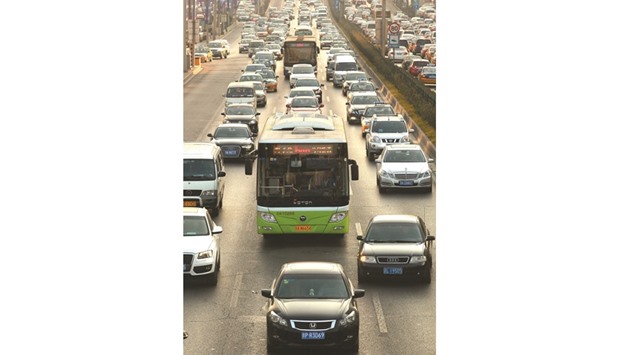 Vehicles creep slowly through heavy traffic in downtown Beijing. Asia, where Iran was permitted to sell oil during the restrictions, will remain its main target and an area of competition with Saudi Arabia.