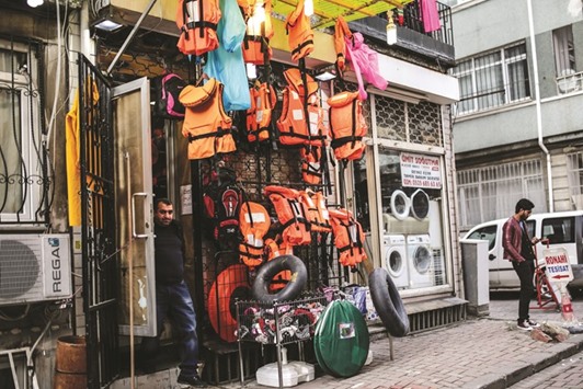 Life jackets, inner tubes of tyres and woolie hats are on sale at a store in Kumkapi district of Istanbul.