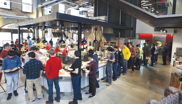 The employee cafeteria of Googleu2019s new Canadian engineering headquarters in Kitchener-Waterloo, Ontario. Google-parent Alphabetu2019s reported quarterly profit rose 5% to $4.92bn on the back of strong online advertising revenue, particularly from searches done by holiday season shoppers using smartphones or tablets.