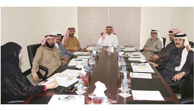 QC committee on real estate members during a meeting.