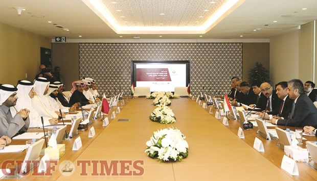 Qatari and Tajikistan delegates attend a meeting in Doha yesterday.