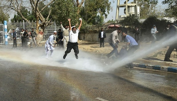 Police use a water cannon on Pakistan International Airlines employees at a protest near Karachi International Airport yesterday.