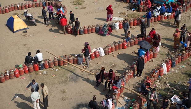 People queue to refill gas cylinders in Kathmandu.