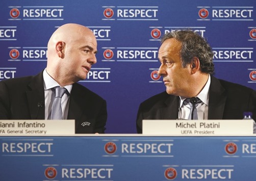 File picture of then UEFA general secretary Gianni Infantino (L) and UEFA president Michel Platini (R) during a press conference.