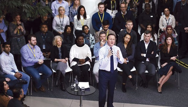 Prime Minister David Cameron answers questions after delivering a speech on the European Union to workers and guests at the headquarters of O2 in Slough, west of London, yesterday.