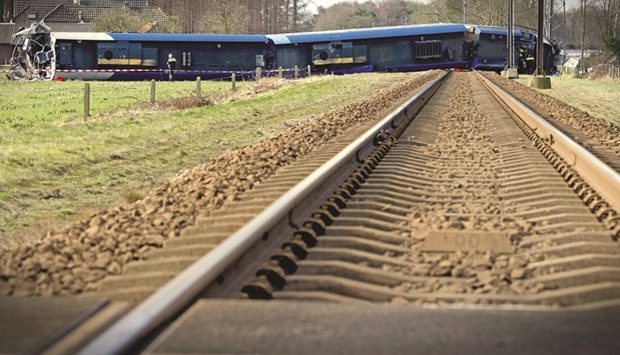 The scene of a derailed passenger train near Dalfsen, eastern Netherlands, after it collided with a hydraulic crane, leaving one person dead and six injured, local officials said.
