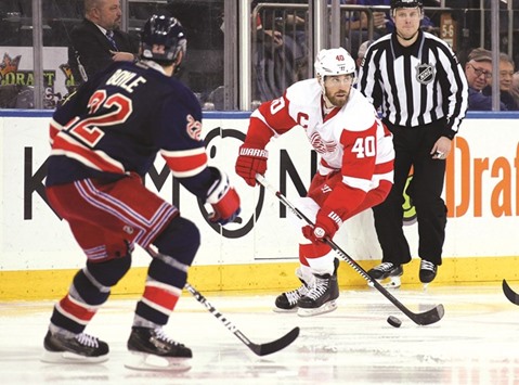 Henrik Zetterberg (right) of the Detroit Red Wings skates against the New York Rangers on Sunday. (AFP)