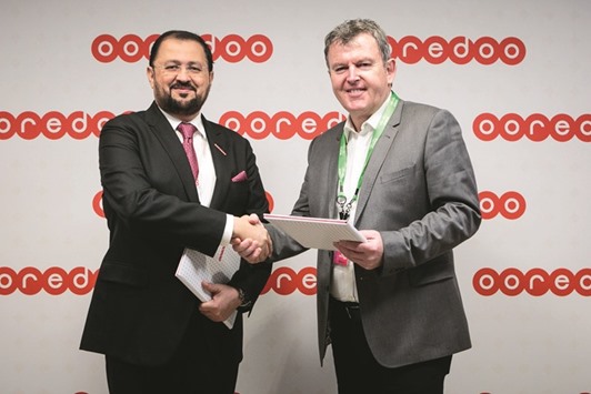 Al-Sayed (left) with Chris Dedicoat, executive vice-president (Worldwide Sales - Cisco) exchange the agreements at the Mobile World Congress in Barcelona.