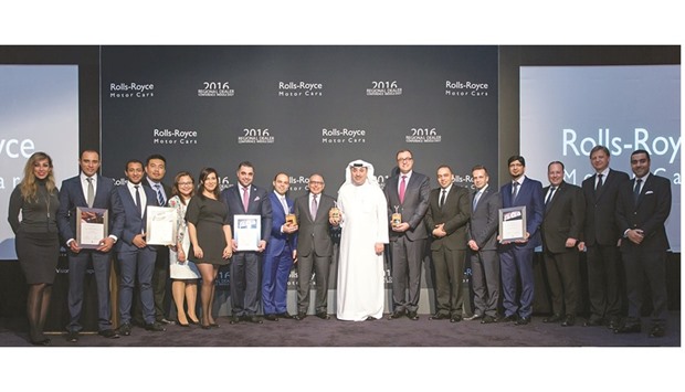 The award winners and officials of Rolls-Royce Motor Cars Doha with Omar Alfardan at the ceremony.