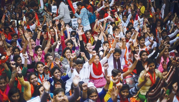 Activists from the Akhil Bharatiya Vidyarthi Parishad (ABVP), the studentu2019s wing of the Bharatiya Janata Party (BJP), raise their hands and shout slogans during a protest march in New Delhi yesterday. Thousands of ABVP members carried out the march against u201canti-national sloganeeringu201d raised at the Jawaharlal Nehru University (JNU) campus.