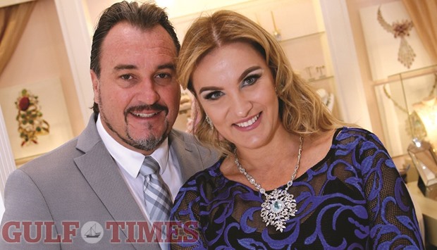 Marcelo Albuquerque and his wife Ana, sporting ornaments created in her own designs, at the Goldesign stall at Alfardan Jewellery pavilion yesterday. PICTURE: Jayaram