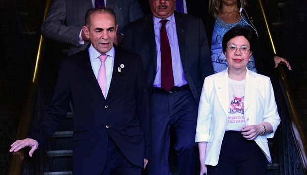 World Health Organization Director General Margaret Chan, accompanied by Brazil's Health Minister Marcelo Castro (left), arrives at the Oswaldo Cruz Research Institute in Rio de Janeiro. Chan expressed confidence that Brazil can host the Rio Olympics safely despite the Zika threat.